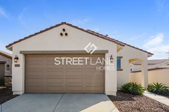a home with a garage door with streetlane homes logo on it