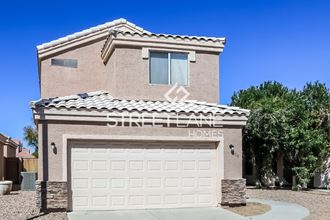a brick house with a white garage door