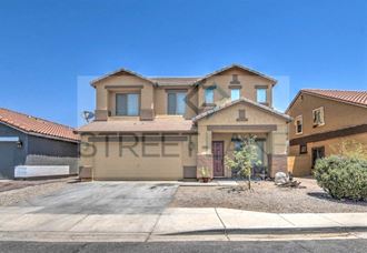 a house with a driveway and a street in front of it