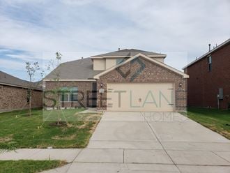 a house with a garage door with the word sitan home on it