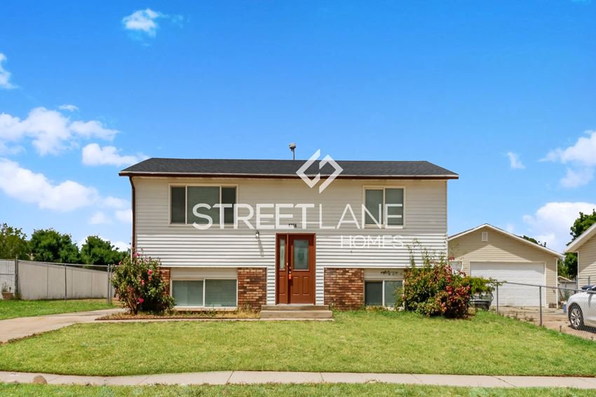 A charming home with 3 bedrooms and 1 bath in Salt Lake City is NOW available for move-in! Home is located near Kearns rec center and Utah Olympic Oval. - Photo Gallery 1