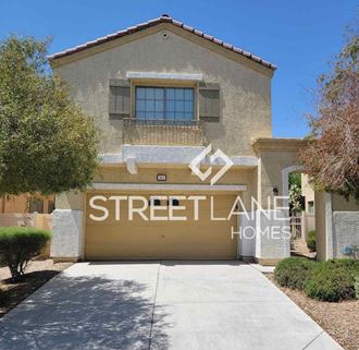 a home with a garage door with streetland homes logo on it