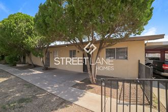 a streetline homes building with a tree in front of it