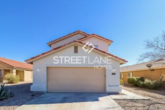 a streetlane homes garage door with a house behind it