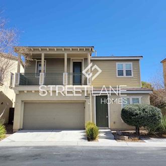 a house with a garage door and a street name on it