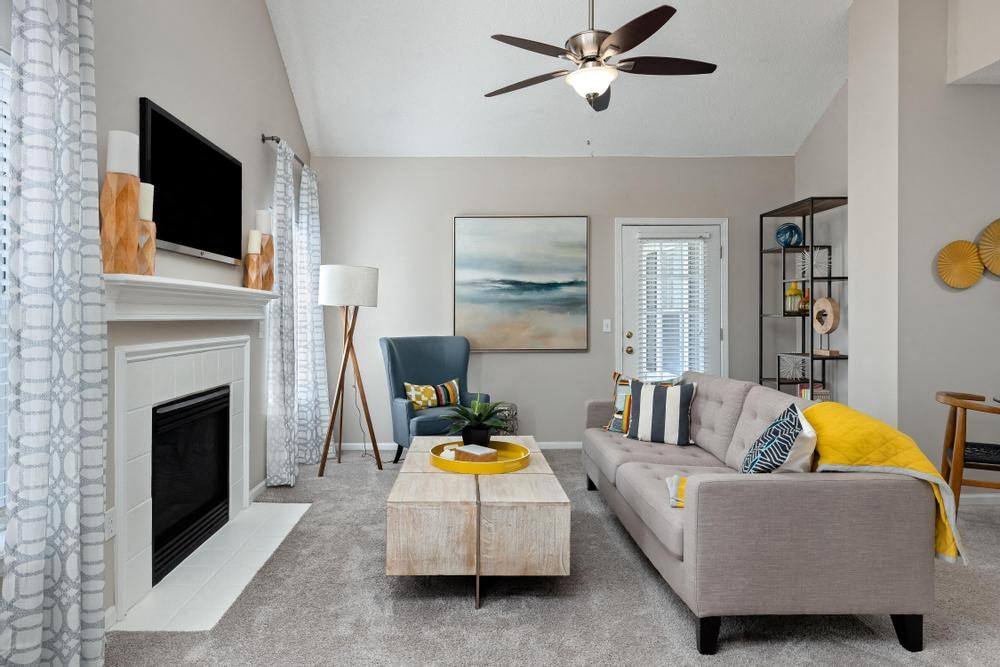 a living room with a couch and a fireplace