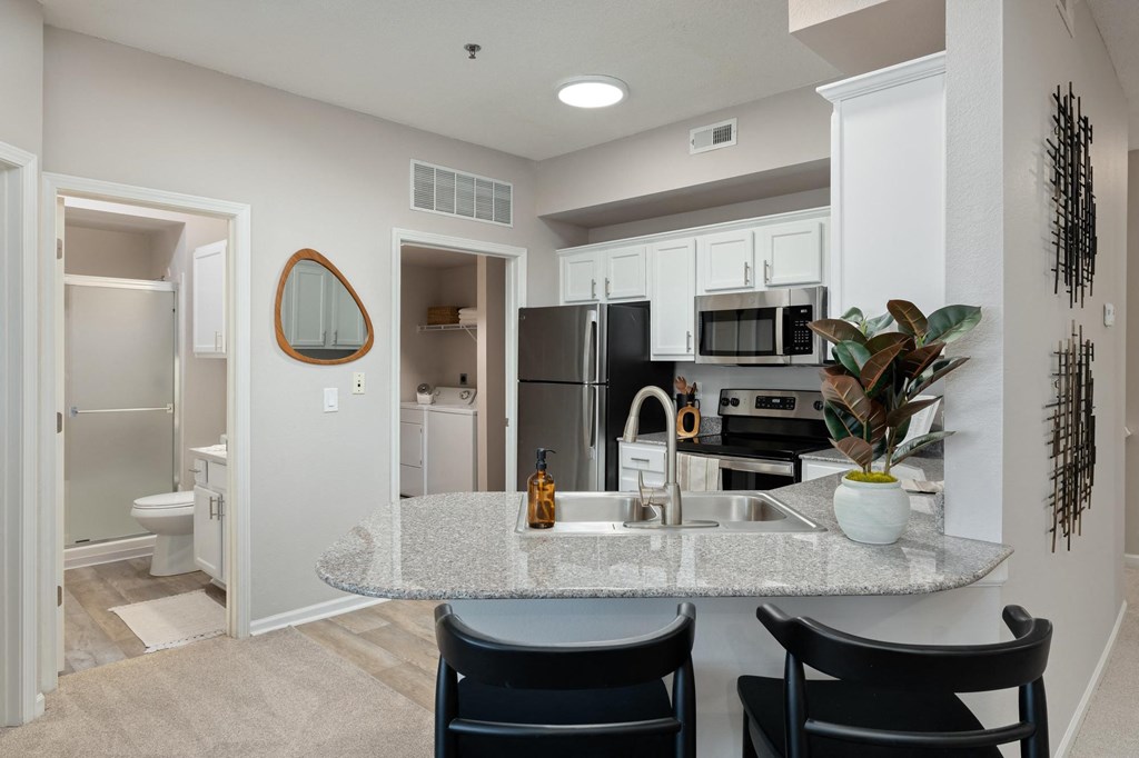 a kitchen with a granite counter top and a sink