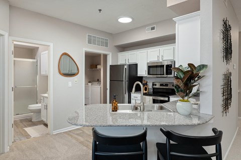 a kitchen with a granite counter top and a sink