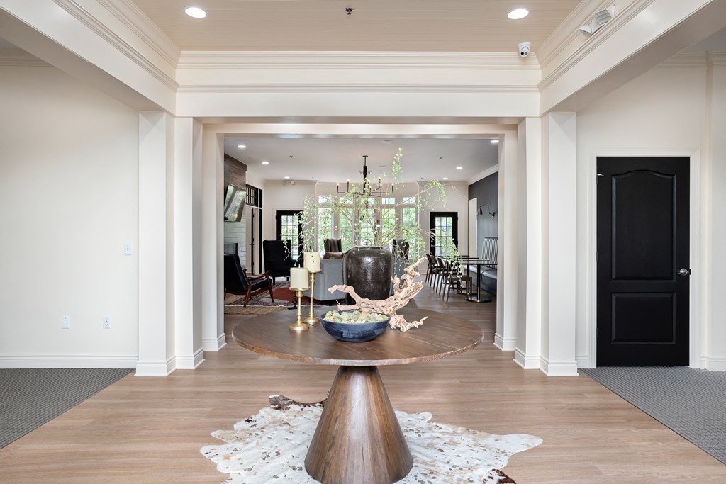 a dining room with a table and a chair in the middle