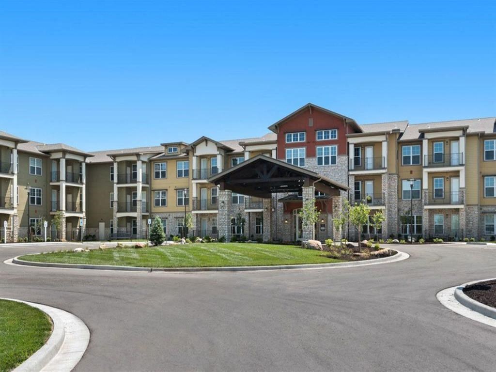 a roundabout in front of an apartment building
