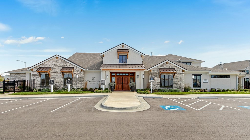 a large house with a driveway and a parking lot