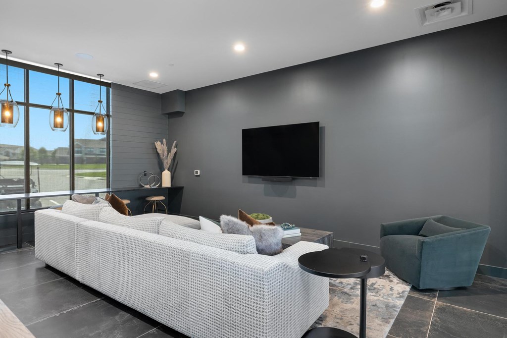 a living room with a couch and a tv