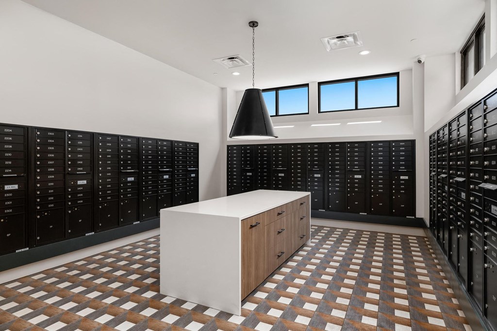 a wine room with wooden racks and a white table