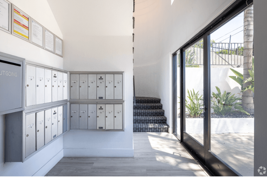 a view of the inside of a building with lockers and a staircase
