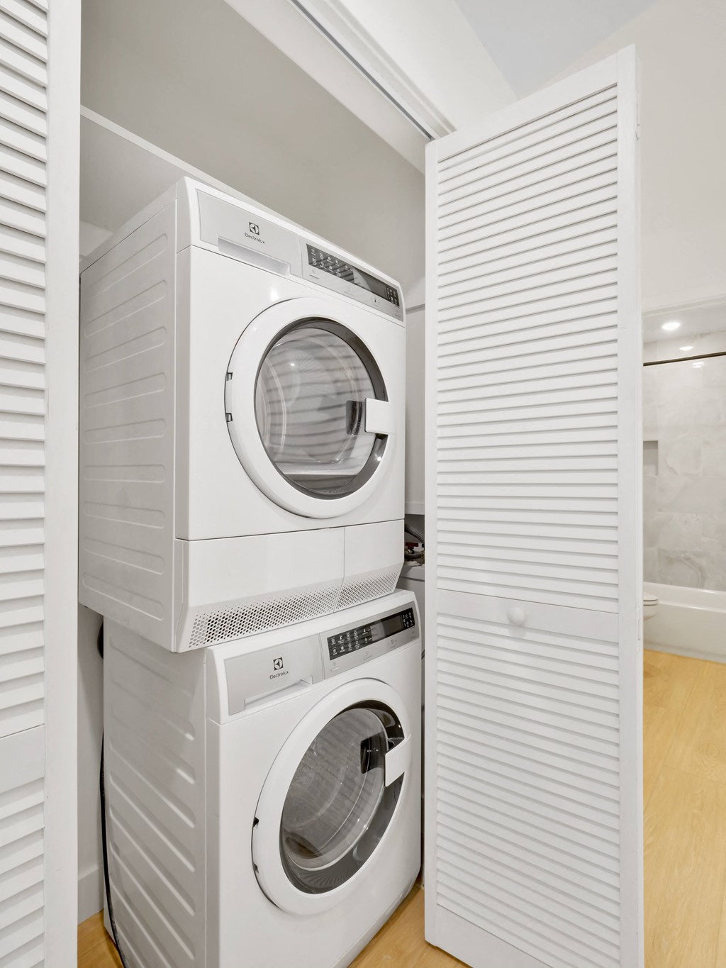 a washer and dryer stacked on top of each other in a laundry room
