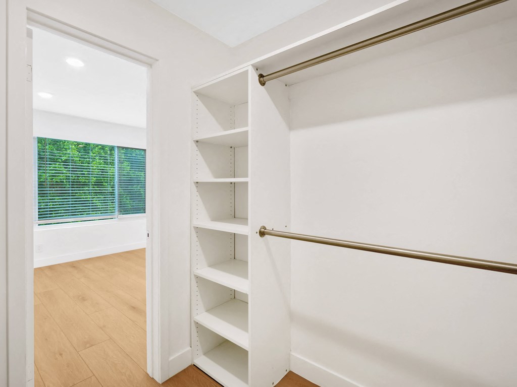 a walk in closet in a 555 waverly unit