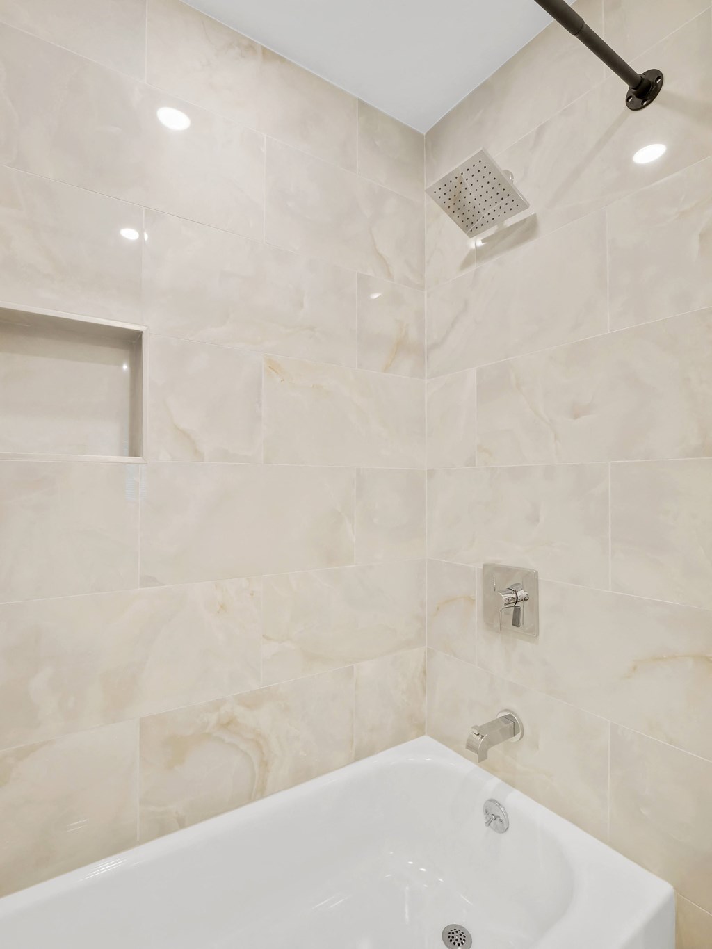 a bathtub and shower in a 555 waverly unit