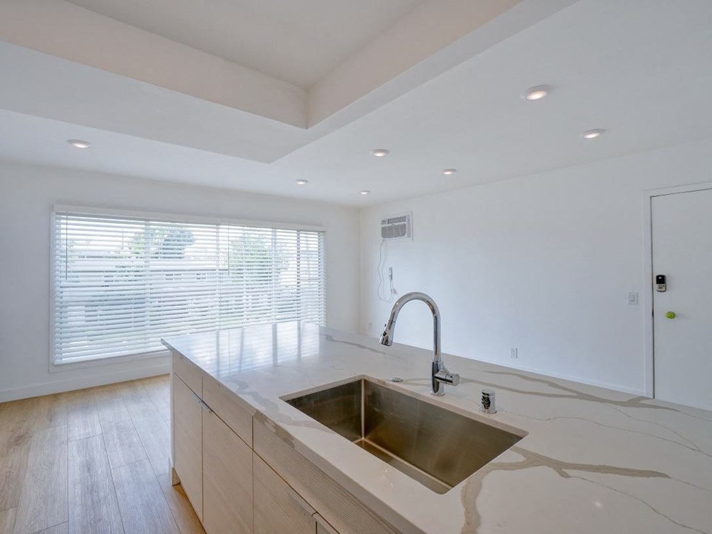 a kitchen with a sink and a window