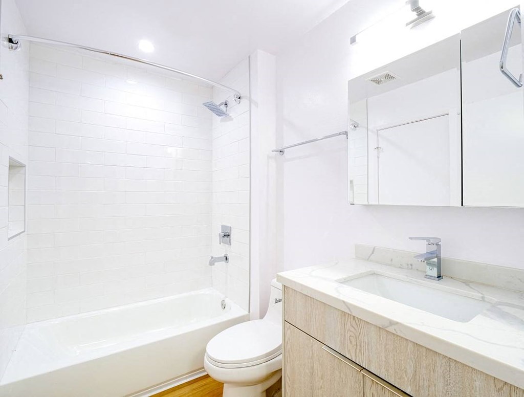 a bathroom with a sink toilet and a shower