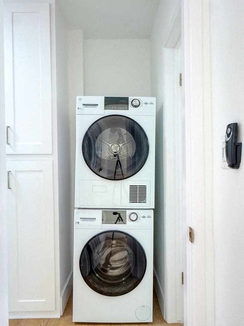 a white washer and dryer in a small room