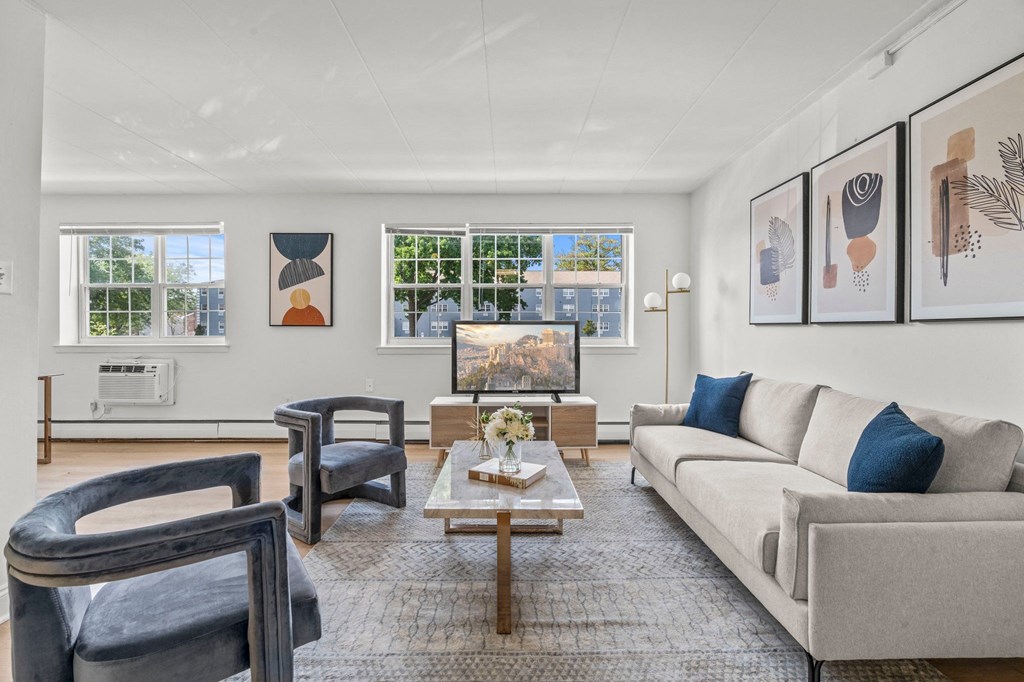 a living room with a couch chairs and a coffee table  at Chestnut Hill Village, Pennsylvania