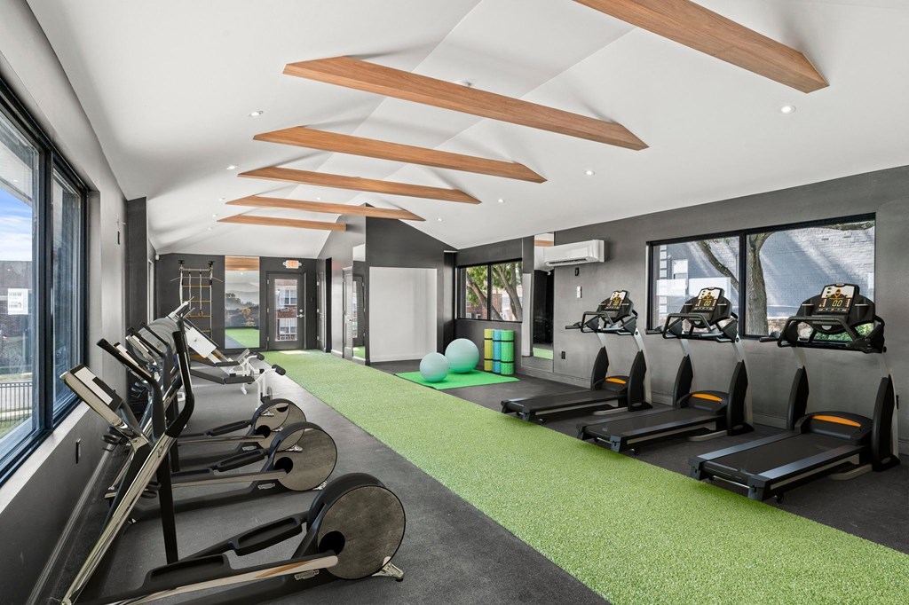 a gym with treadmills and other exercise equipment  at Chestnut Hill Village, Philadelphia, PA
