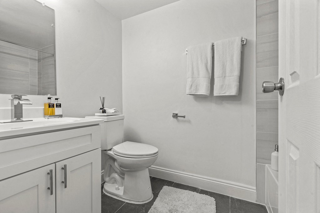 a bathroom with a toilet sink and shower  at Chestnut Hill Village, Philadelphia