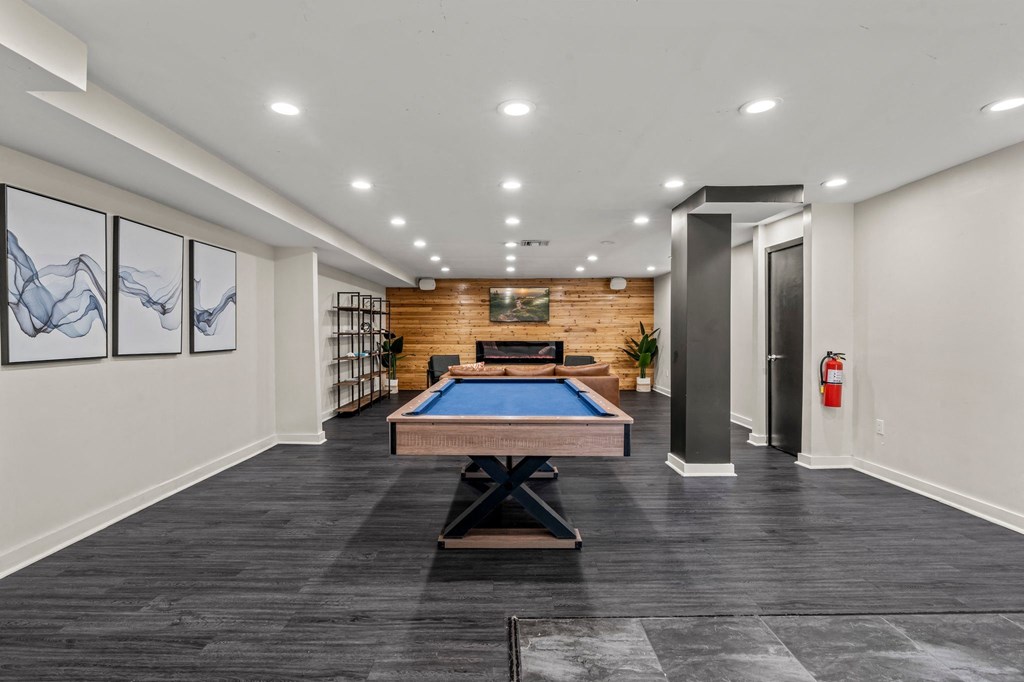 a game room with a pool table and a fire hydrant