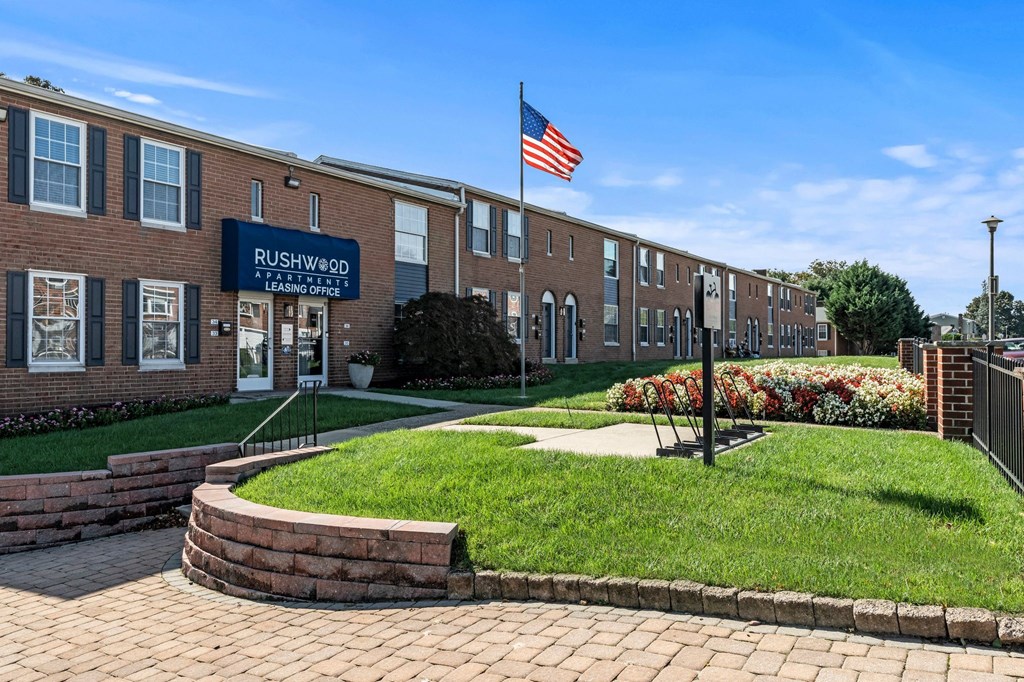 a brick building with an flag in front of it