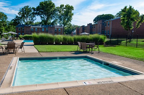 our apartments have a resort style pool and lounge chairs