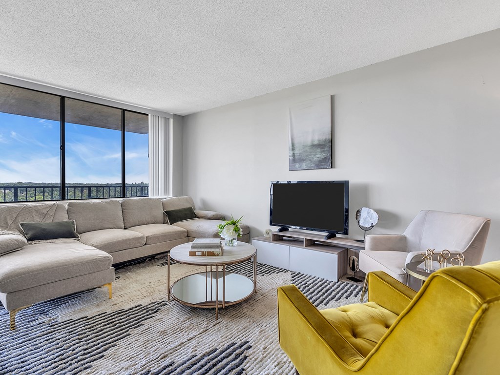 Living room with couch and table at PREMIER @ CITY LINE, Philadelphia