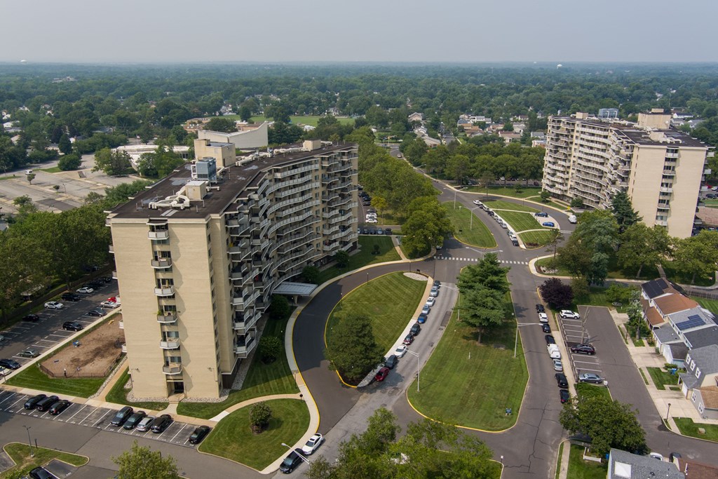 A large building with a parking lot in front of it.