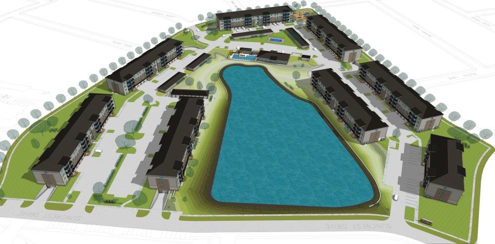 A blue pool is surrounded by apartment buildings.