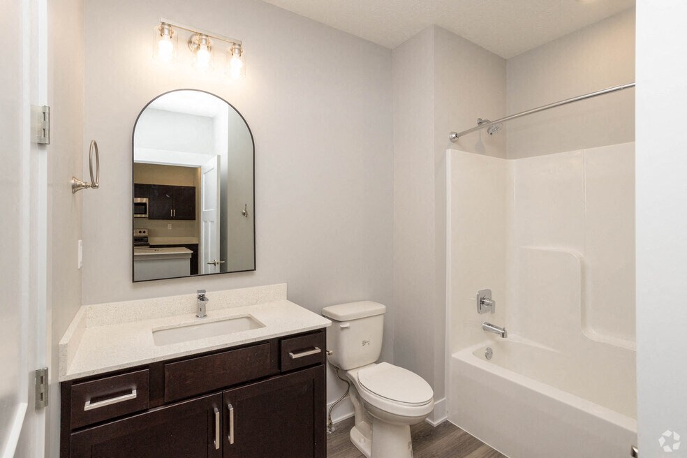 a bathroom with a sink toilet and a shower