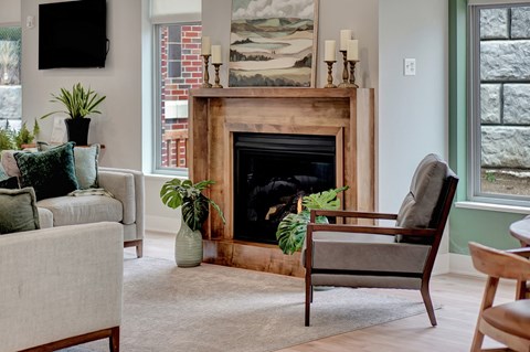 a living room filled with furniture and a fireplace