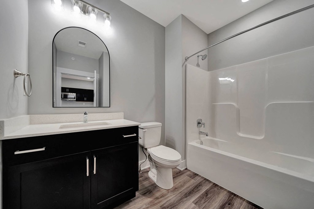 a bathroom with a sink toilet and a shower
