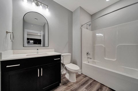 a bathroom with a sink toilet and a shower