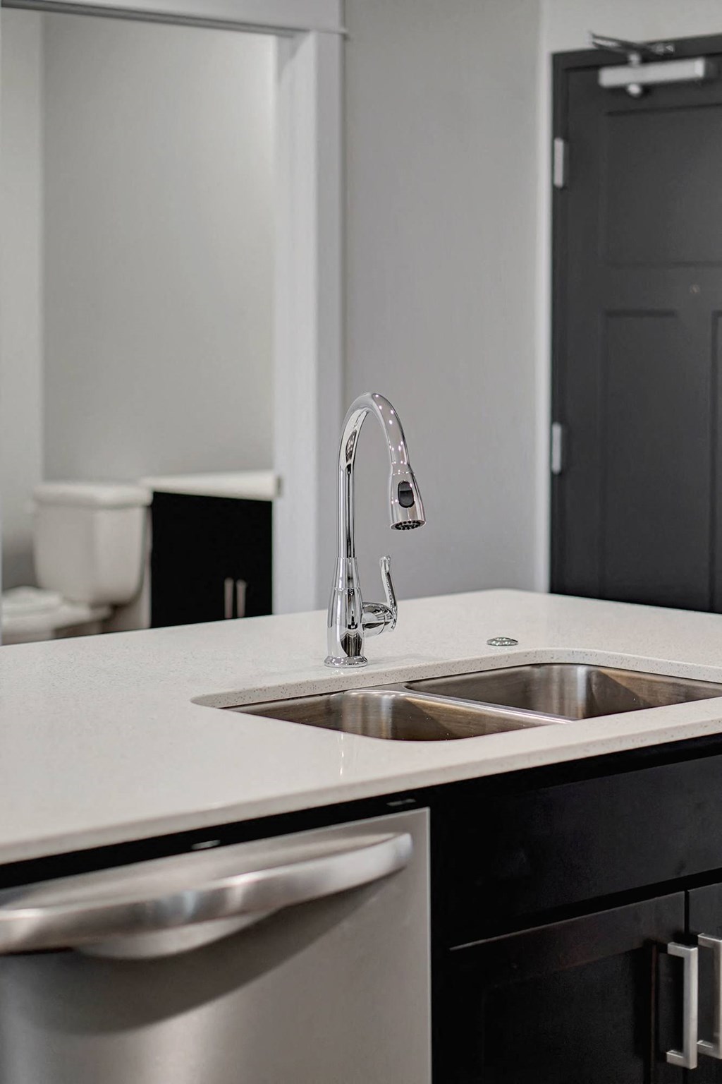 a reflection of a water faucet in a glass table