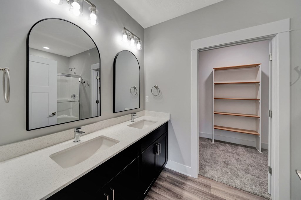 a 3d rendering of a room with different types of outfits on the walls