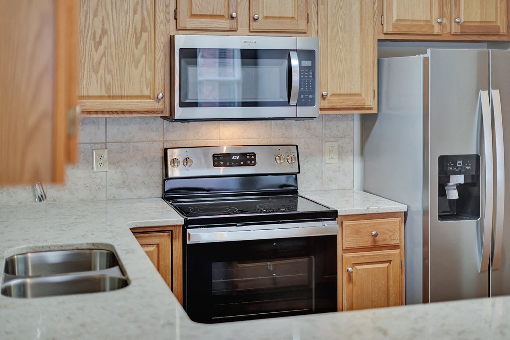 a kitchen with a stove and a microwave