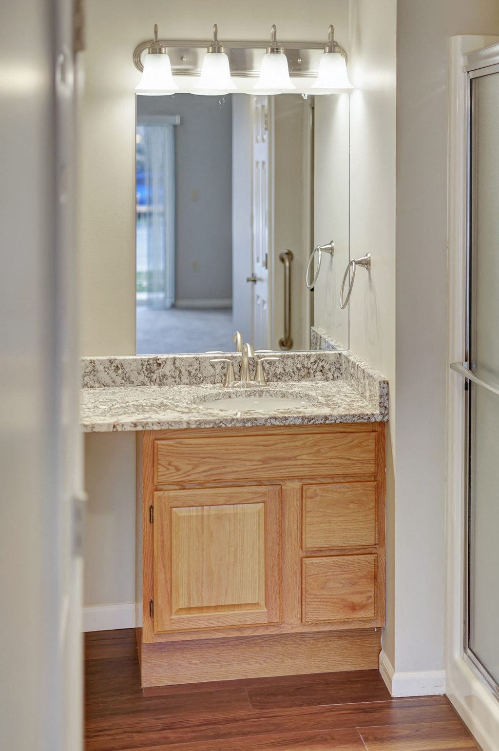 a bathroom with a sink and a mirror