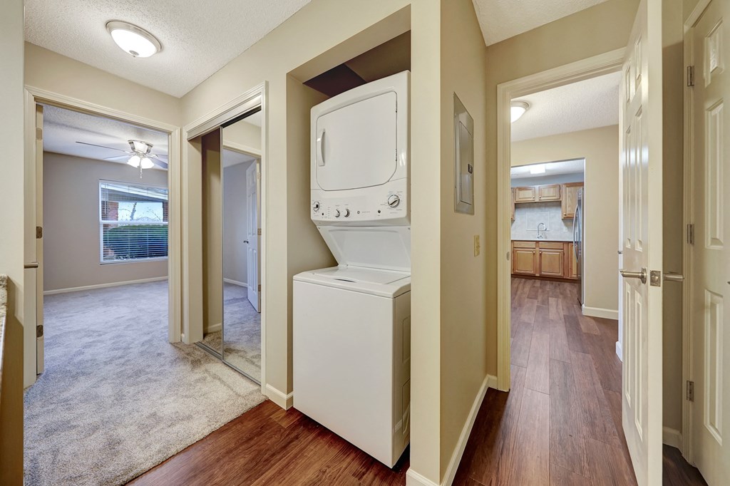 an empty laundry room with a washer and dryer