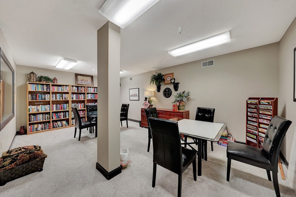 the living room and dining area in our library at our apartments