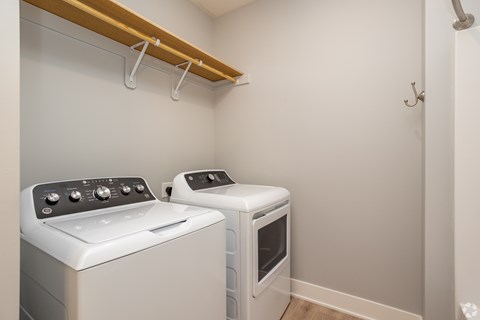 A small kitchen with a stove and toaster oven.