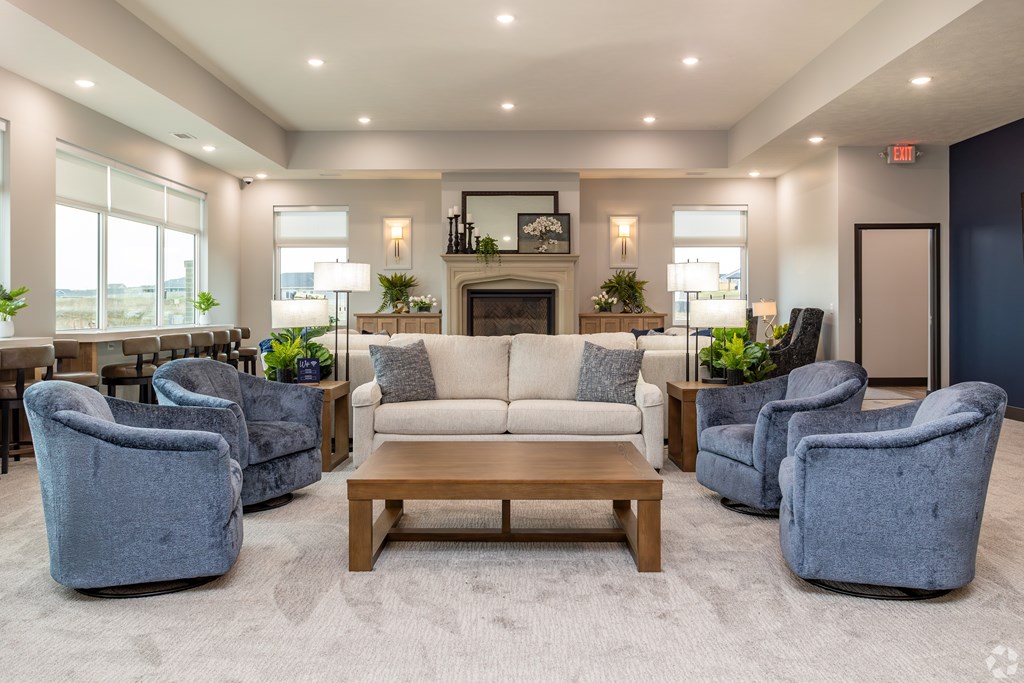 A spacious living room with a fireplace and comfortable seating.