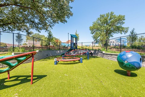 the playground at the flats at big tex apartments