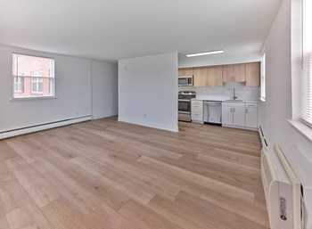 Open Kitchen Layout Luxury Plank Flooring at Brookdale Apartments - Photo Gallery 5
