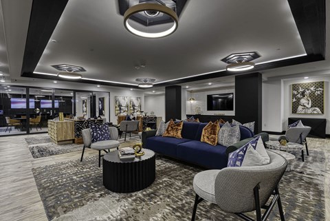 a lobby with couches and chairs and a table