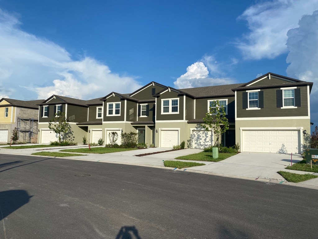 a row of houses on the side of a street
