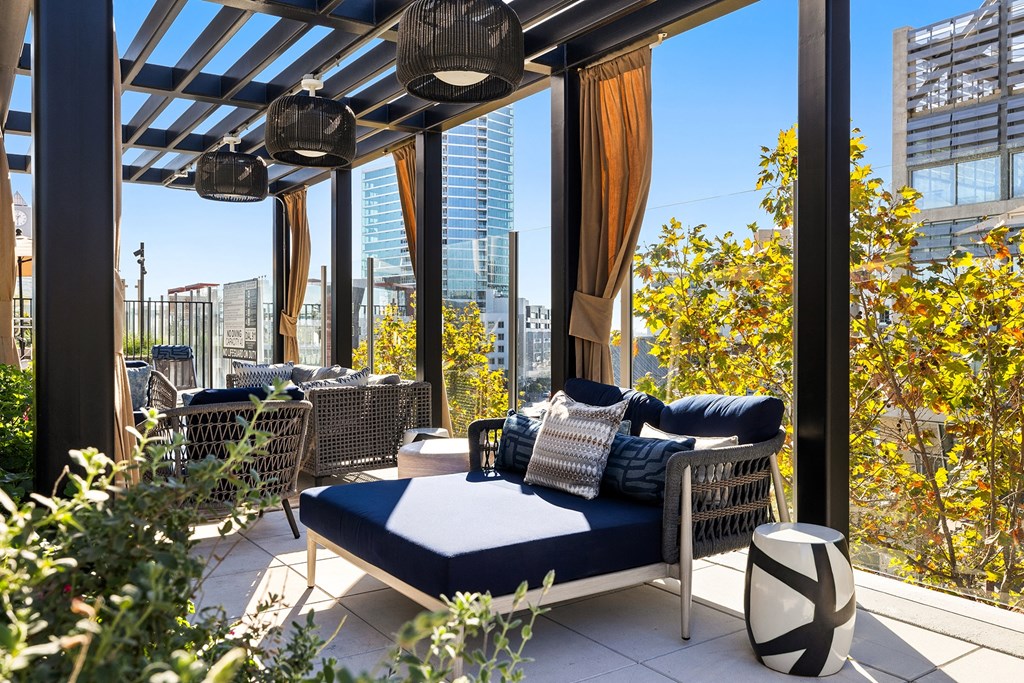 Patio with a couch and a table at K1 Apartments, California